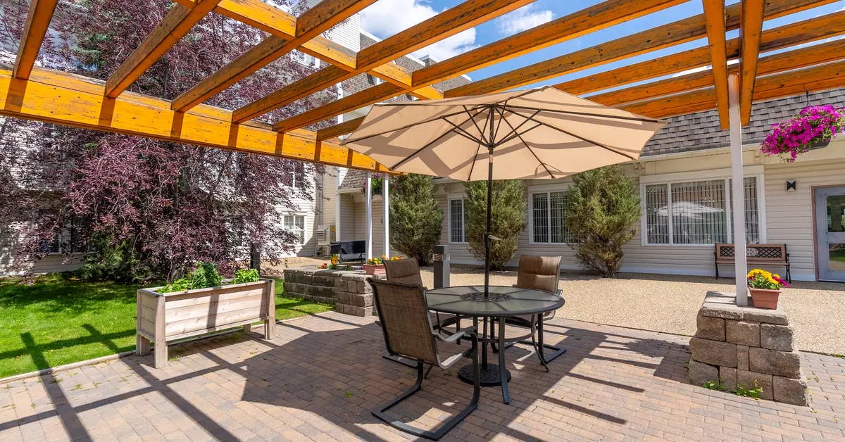 chartwell griesbach, pergola, patio, table, umbrella