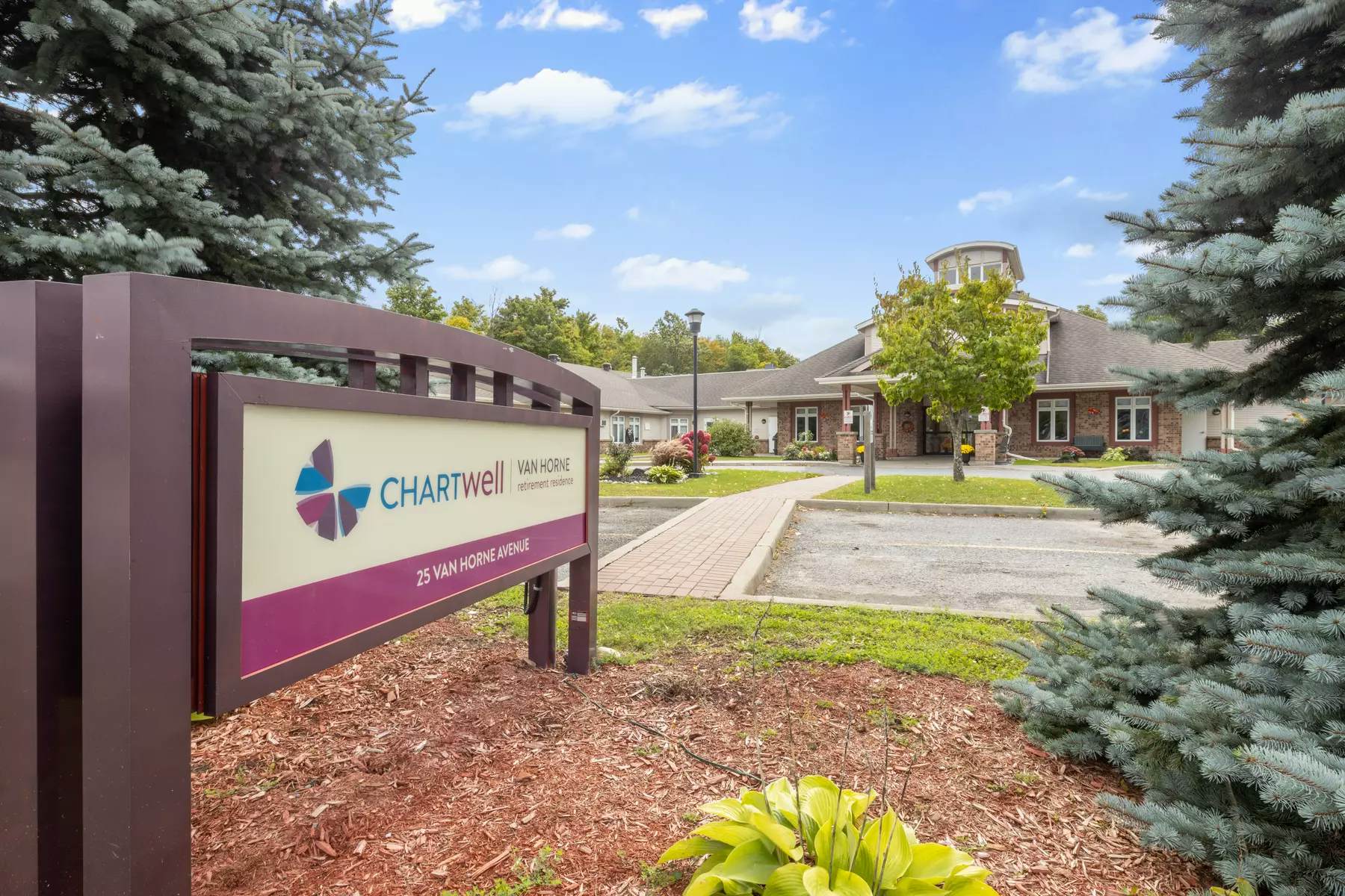 beautiful landscaped grounds at chartwell van horne retirement residence