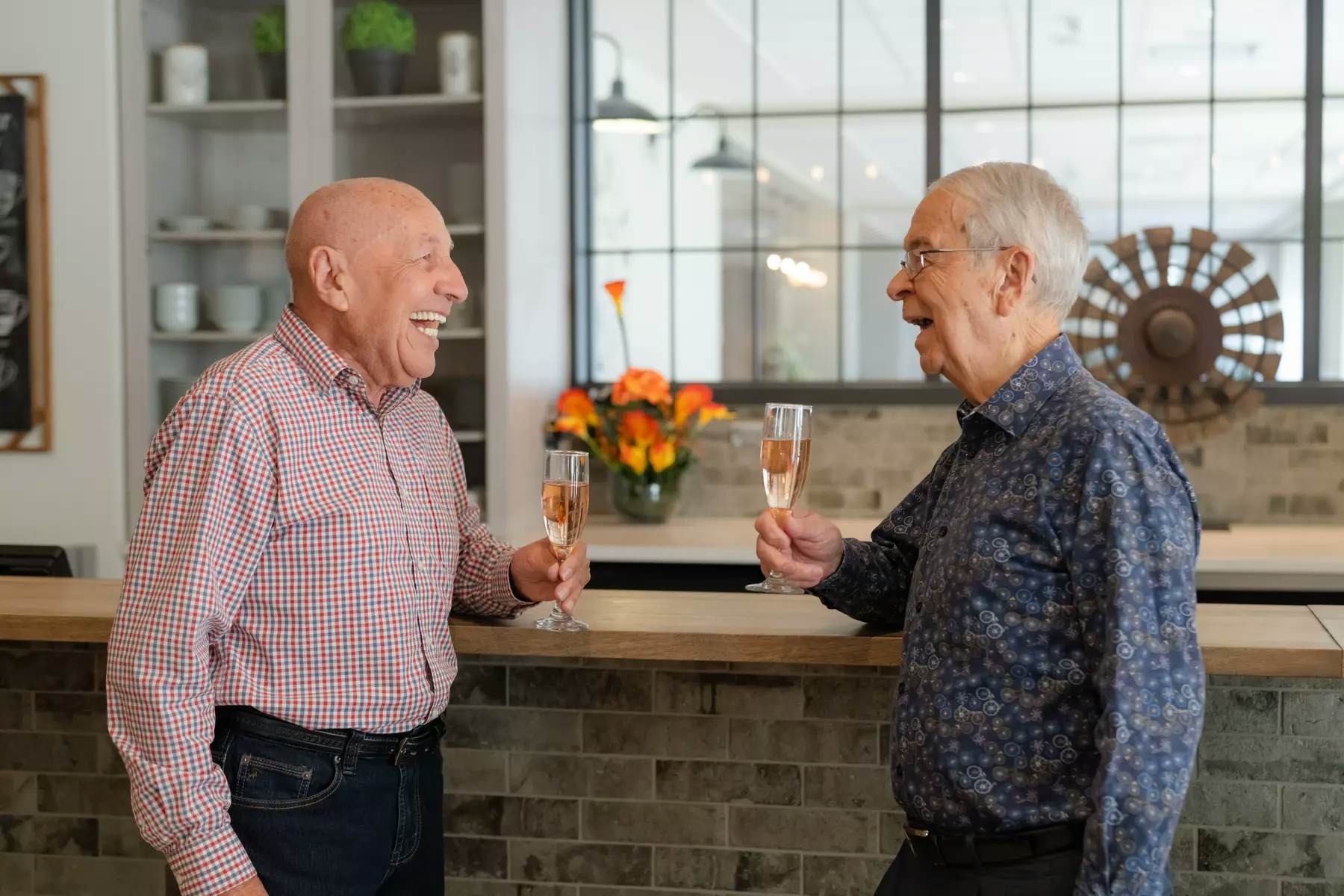 senior-men-drinking-champagne-at-bar