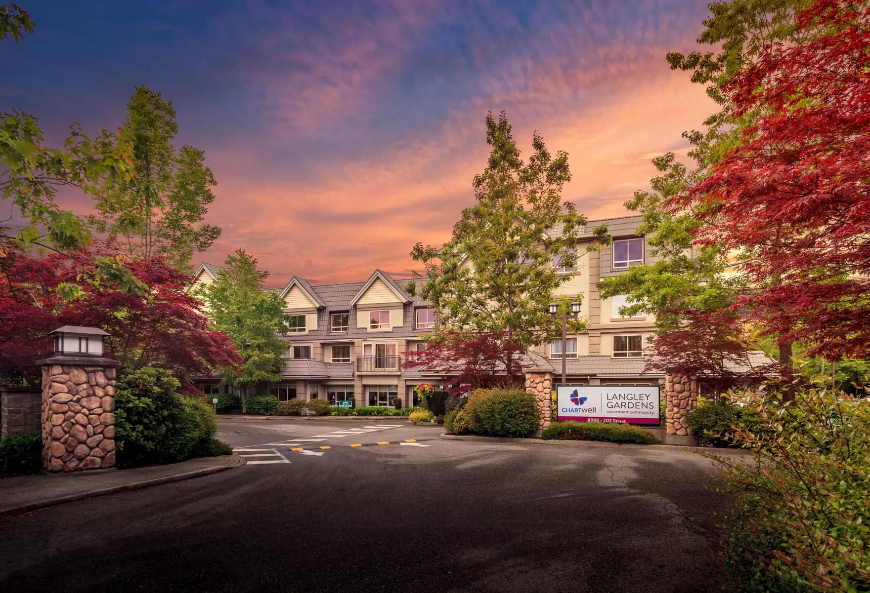 exterior front entrance driveway at chartwell langley gardens assisted living