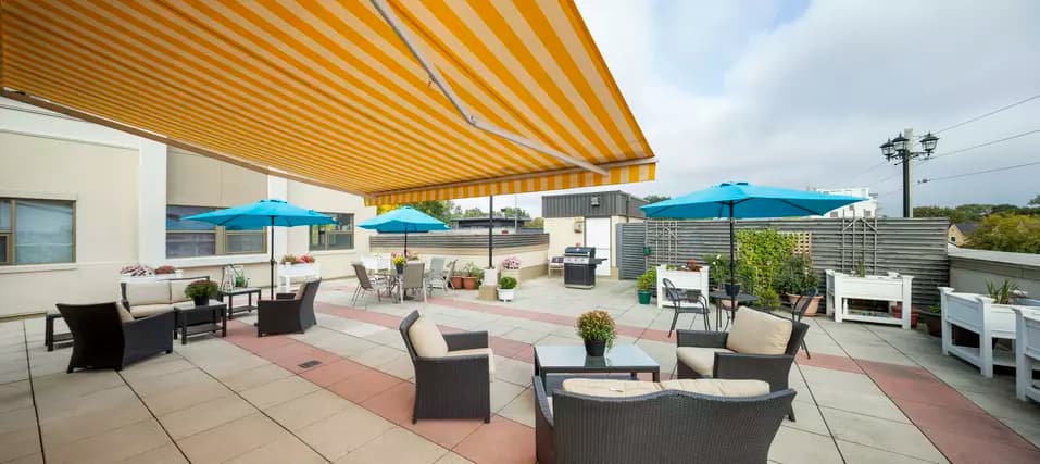 Chartwell Avondale Retirement Residence third floor patio with patio furniture, awning and bbq. 