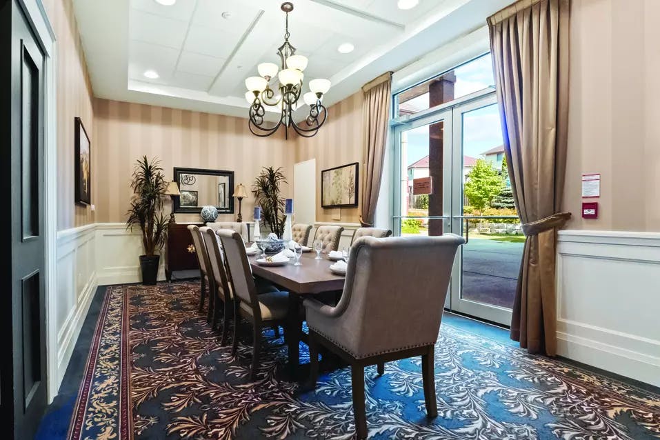 Gorgeous private dining room with walk out patio at Chartwell Deerview Crossing Retirement Residence