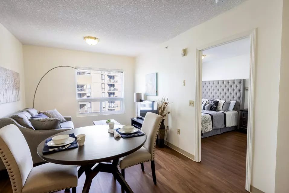 beautiful model suite dining and living room at chartwell eau claire care residence