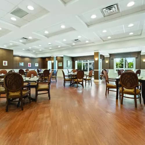 Bright dining room at Chartwell Deerview Crossing Retirement Residence