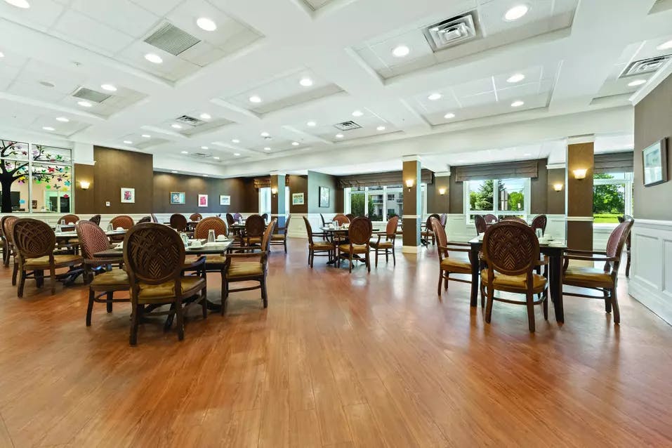 Bright dining room at Chartwell Deerview Crossing Retirement Residence