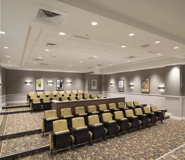 Theatre with comfortable viewing seats at Chartwell Waterford Retirement Residence