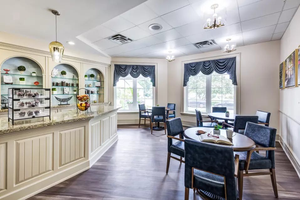 Bistro with seating at Chartwell Queen's Square Retirement Residence