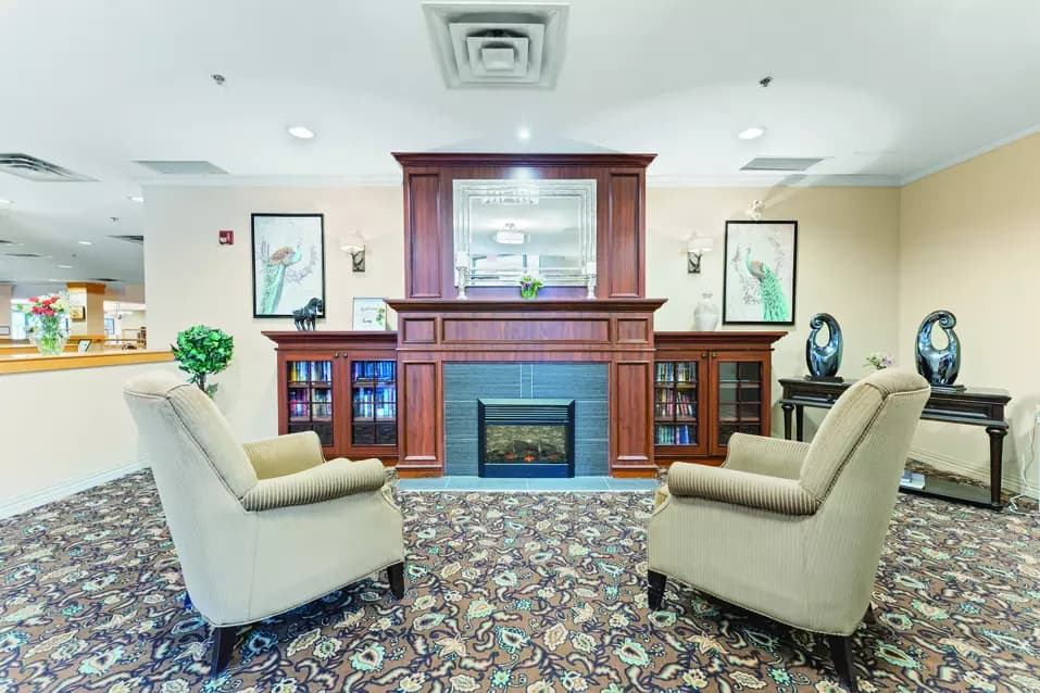 Chartwell Avondale Retirement Residence  lobby lounge with fireplace and seating