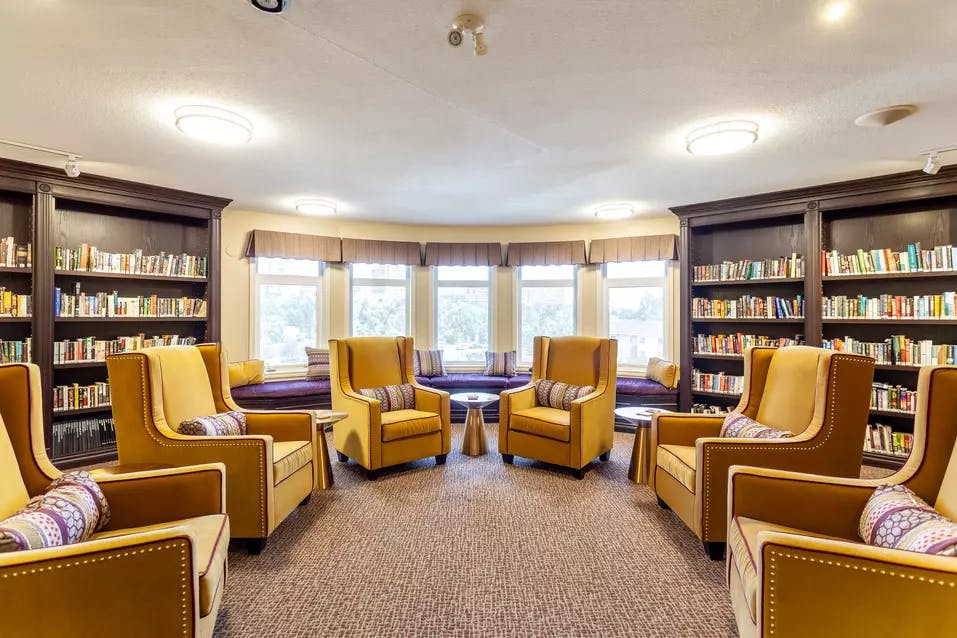 comfortable and colourful library at chartwell colonel belcher retirement residence