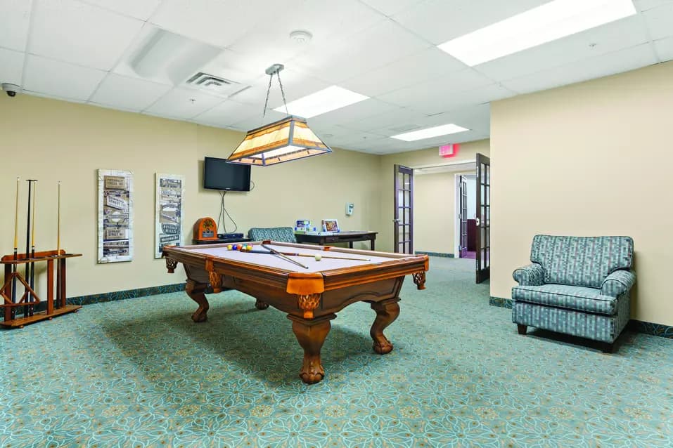 billiards room at chartwell wynfield retirement residence