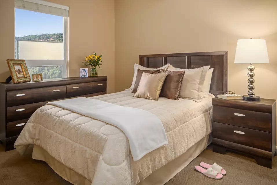 bright and sunny bedroom at chartwell ridgepointe retirement residence