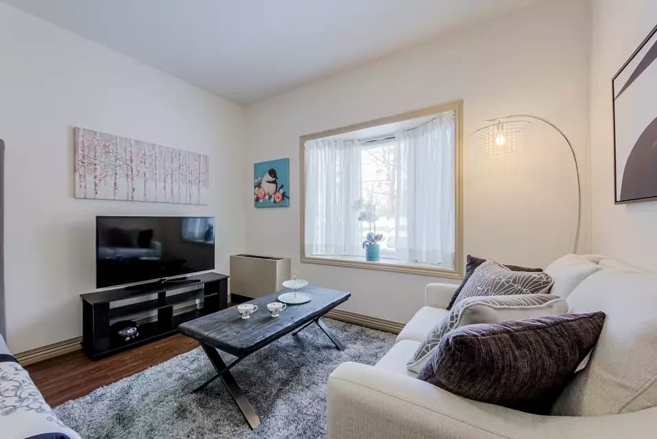 Suite living room at Chartwell Whispering Pines Retirement Residence.