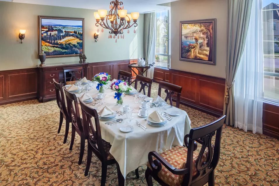 Open and inviting private dining room at Chartwell Valley Vista Retirement Residence 