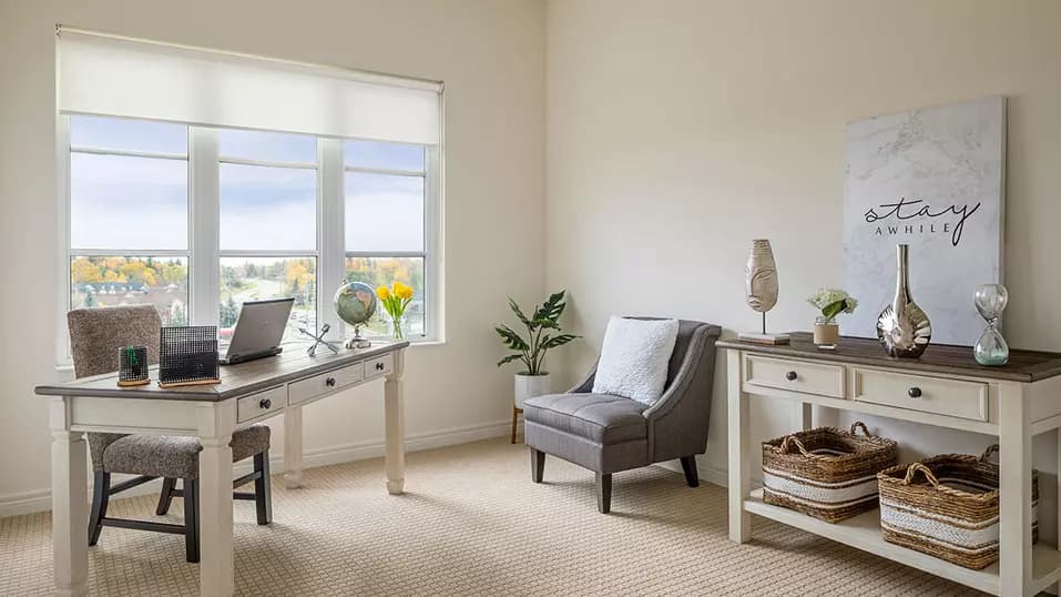 Suite living room with a view at Chartwell Oak Ridges Retirement Residence.