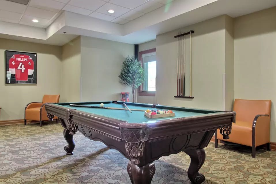billiards room at chartwell wedgewood retirement residence