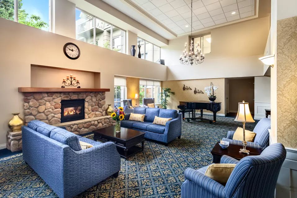 warm and cozy fireside lounge at chartwell langley gardens assisted living