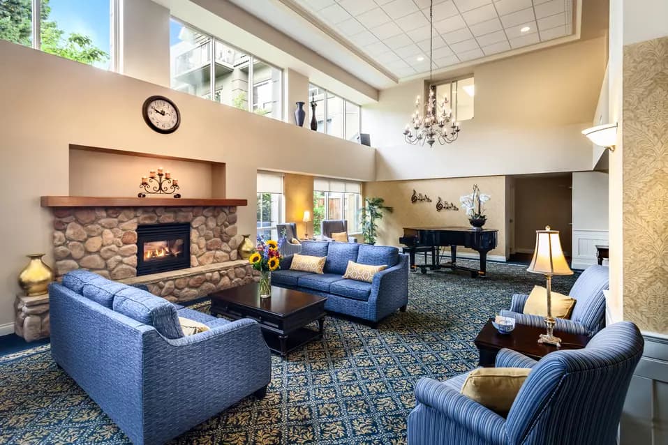 warm and cozy fireside lounge at chartwell langley gardens assisted living