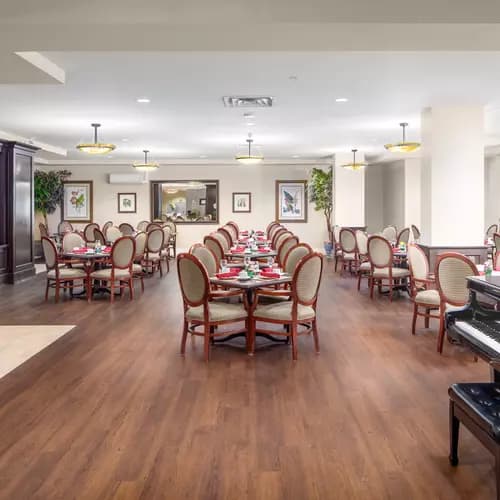 Gorgeous open concept dining room with piano at Chartwell Churchill House Retirement Residence