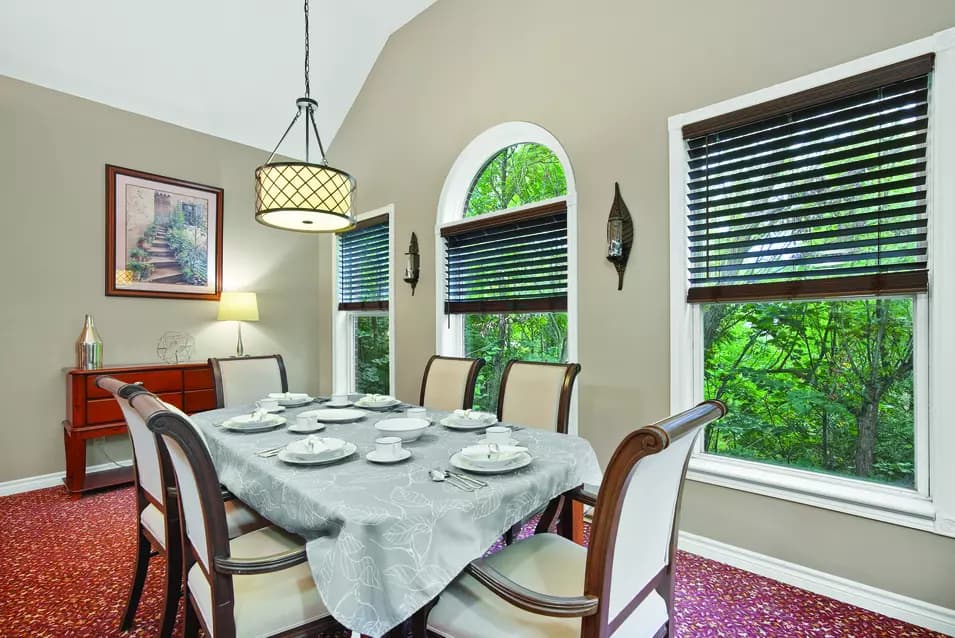 Private dining room with beautiful table settings at Chartwell Georgian Retirement Residence.