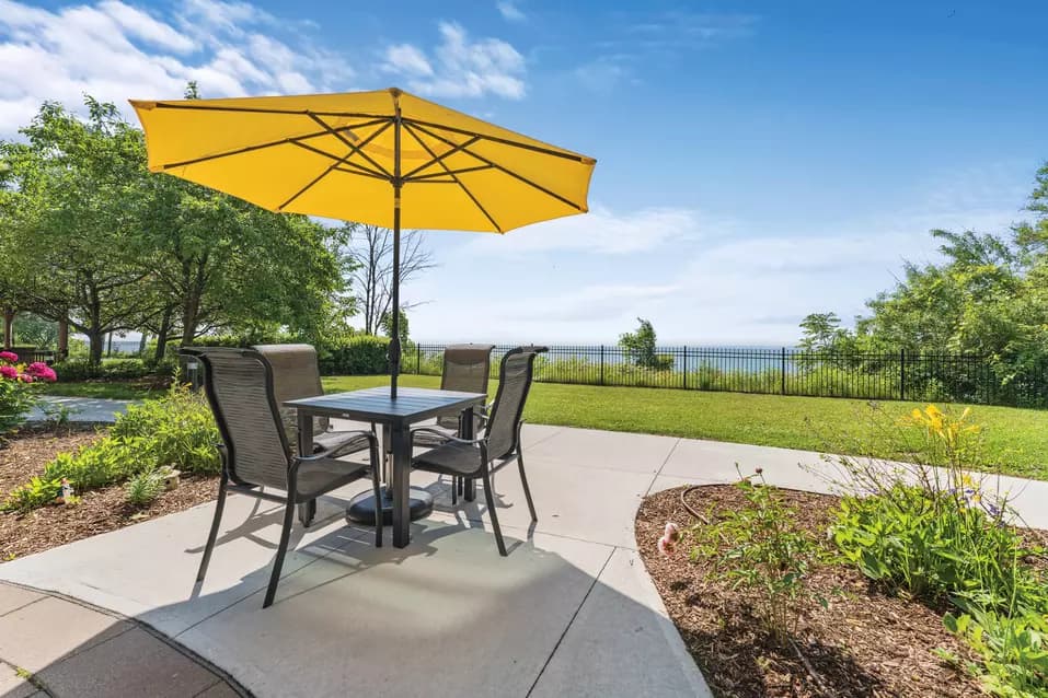 Exterior gardens with view of the lake at Chartwell Lakeshore