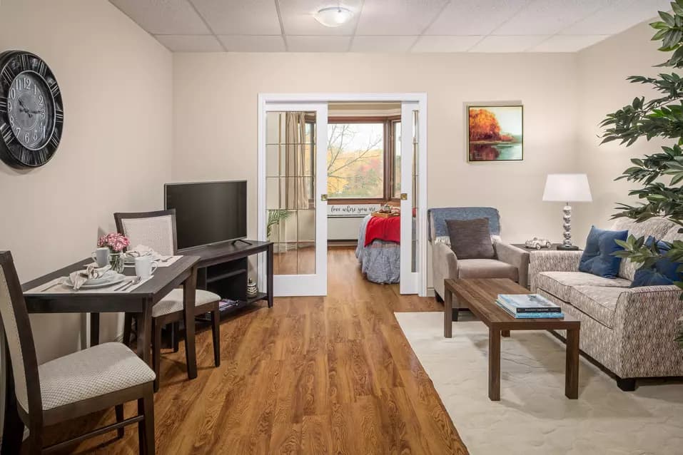 Spacious suite living room at Chartwell Park Place Retirement Residence. 