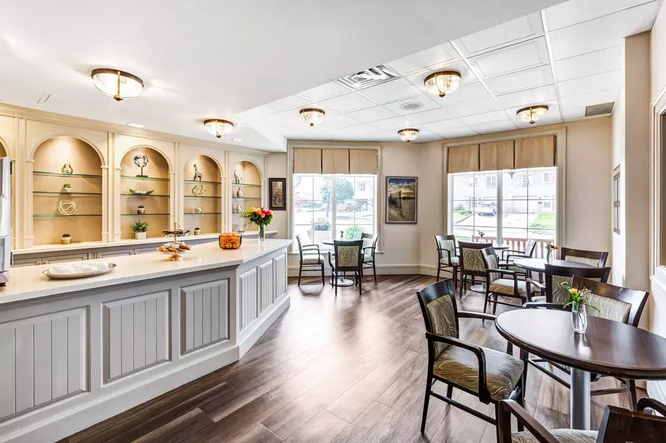 Open concept bistro with seating at Chartwell Bankside Retirement Residence