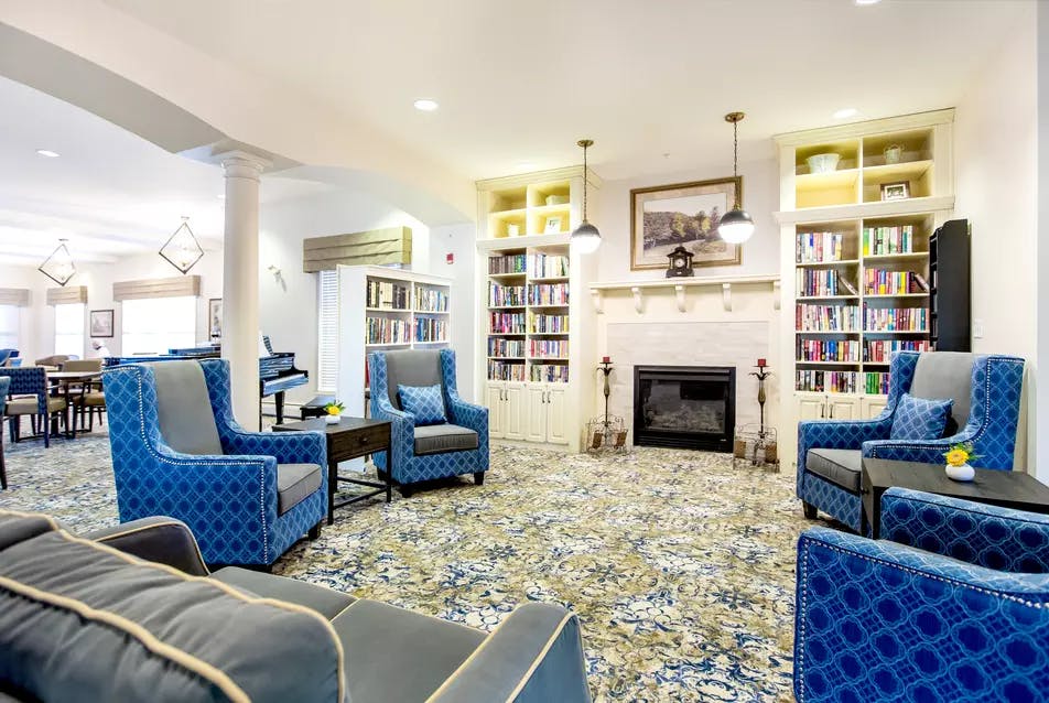 cozy and warm fireside lounge at chartwell hawthorn retirement residence