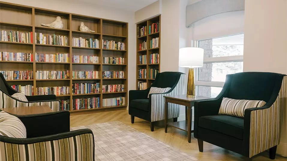 quiet and relaxing library at chartwell eau claire care residence