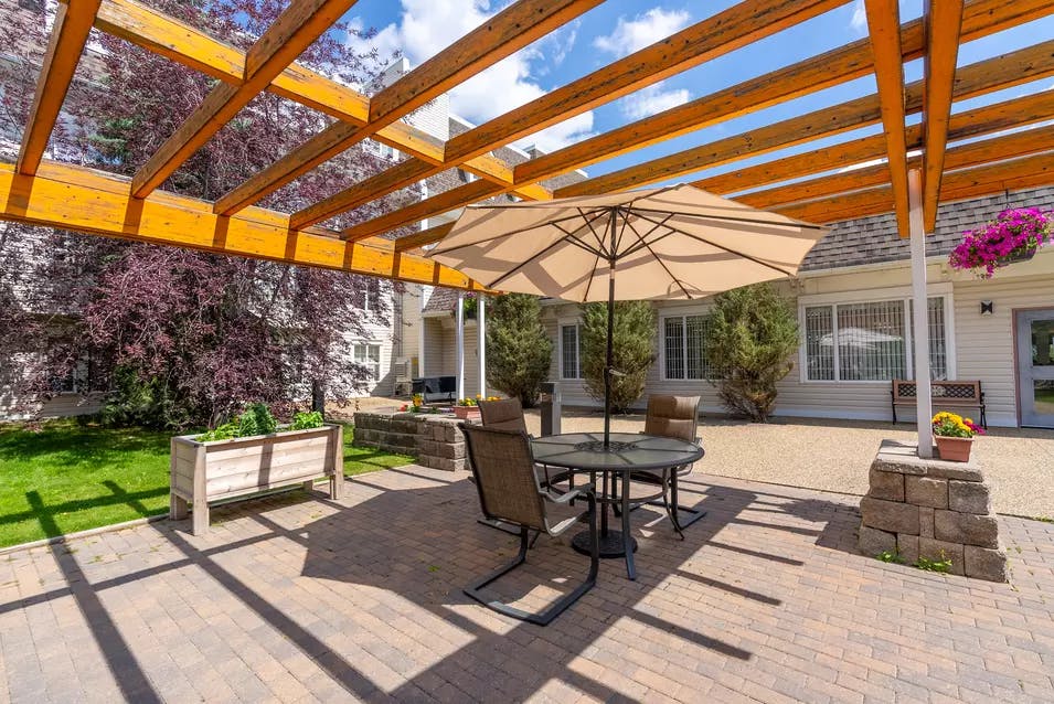chartwell griesbach, pergola, patio, table, umbrella