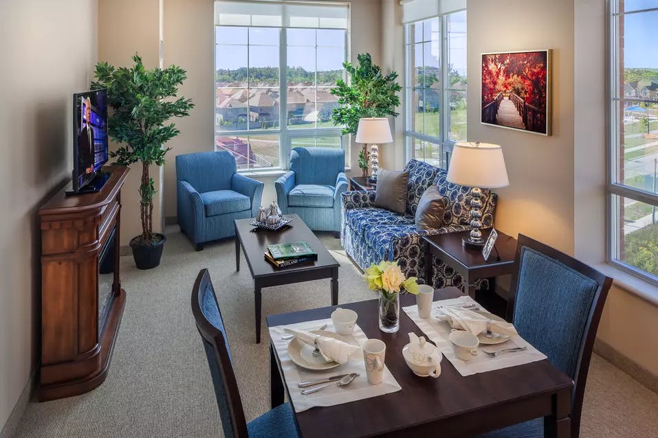 Bright suite living room with gorgeous views at Chartwell Valley Vista Retirement Residence 