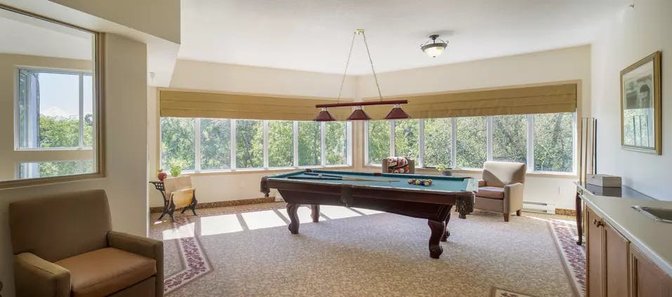 billiards room at chartwell jackson creek retirement residence