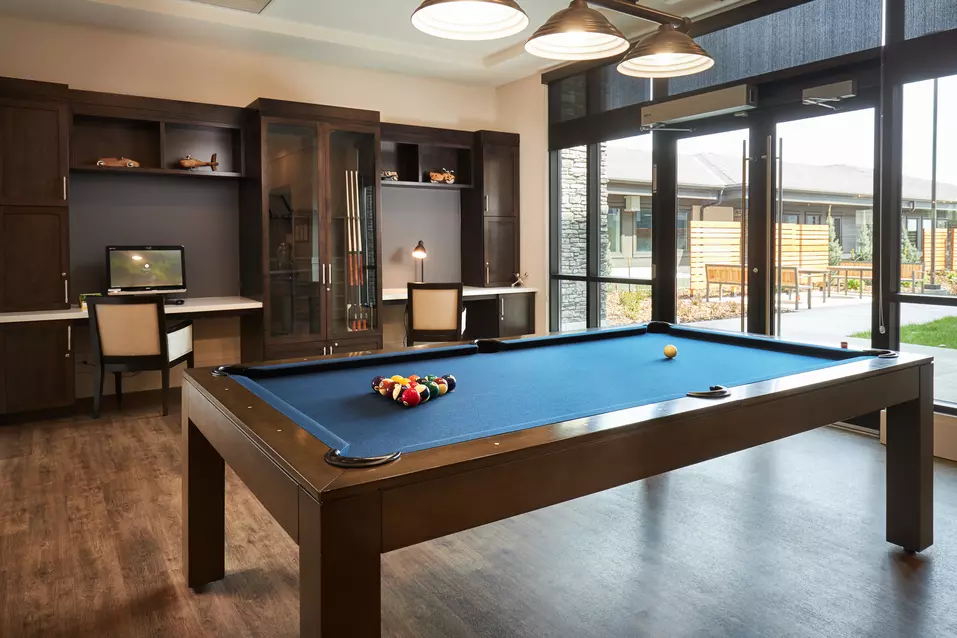 pool table lounge at chartwell wescott retirement residence