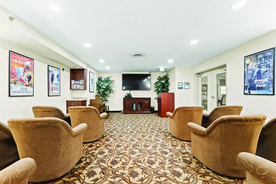 The TV room of Chartwell Rouge Valley Retirement Residence