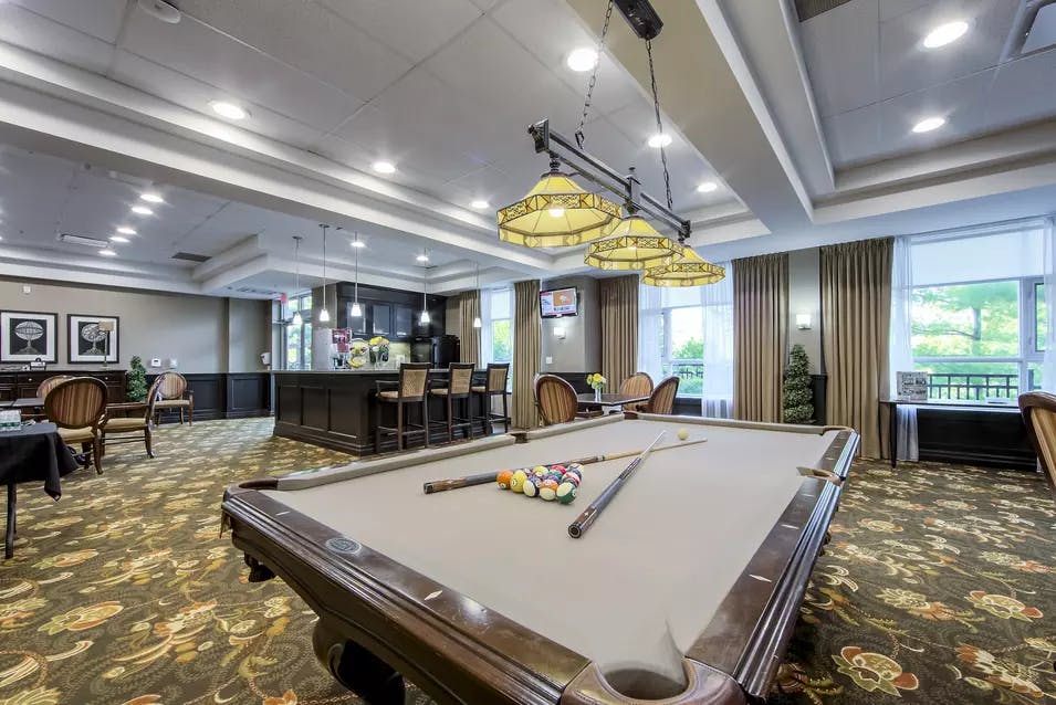 Chartwell Westmount's recreation common area with pool table