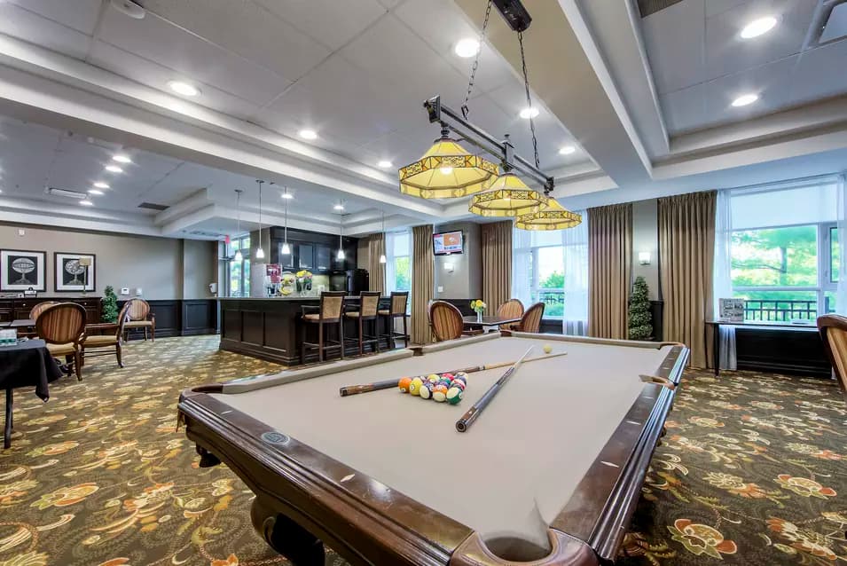 Chartwell Westmount's recreation common area with pool table