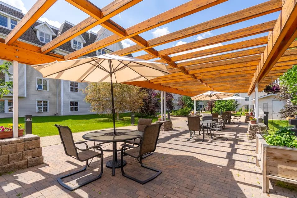 chartwell griesbach, pergola, courtyard, umbrellas, patio tables, patio chairs