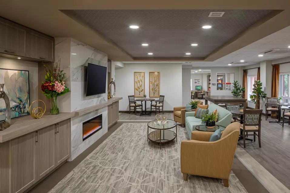 cozy fireplace lounge at chartwell carlton retirement residence