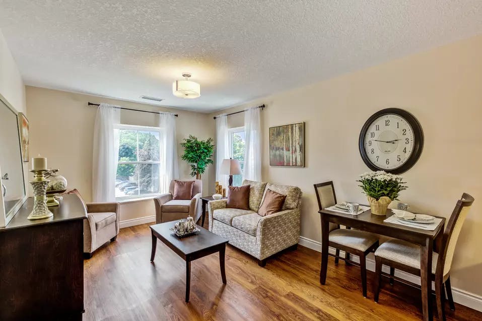 Bright and open living room at Chartwell Queen's Square Retirement Residence