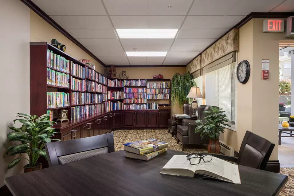 library with table and chairs at chartwell willow care residence