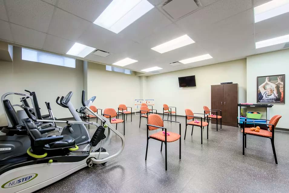 Chartwell Westmount's fitness area with exercise equipment