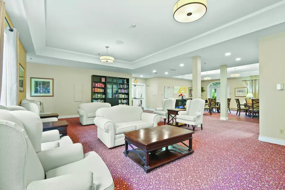 Lounge with comfortable seating at Chartwell Georgian Retirement Residence.