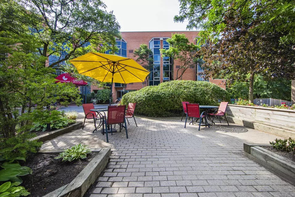 Chartwell Gibson's exterior patio with tables and umbrellas