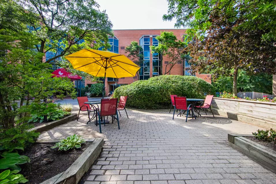 Chartwell Gibson's exterior patio with tables and umbrellas