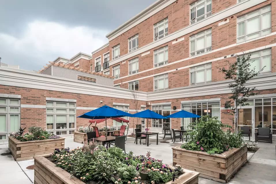 Gorgeous raised gardens and patio at Chartwell Waterford Retirement Residence