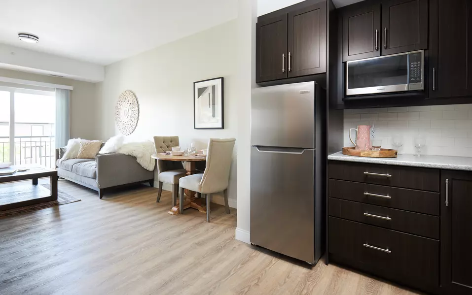 kitchen and living room at chartwell wescott retirement residence