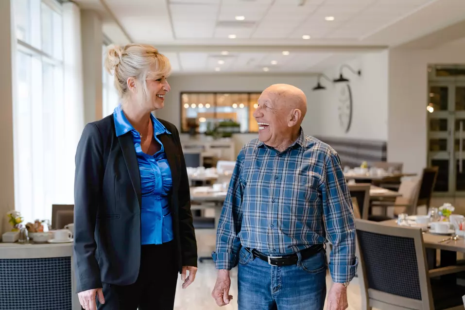 Chartwell Staff showing around the residence to a senior
