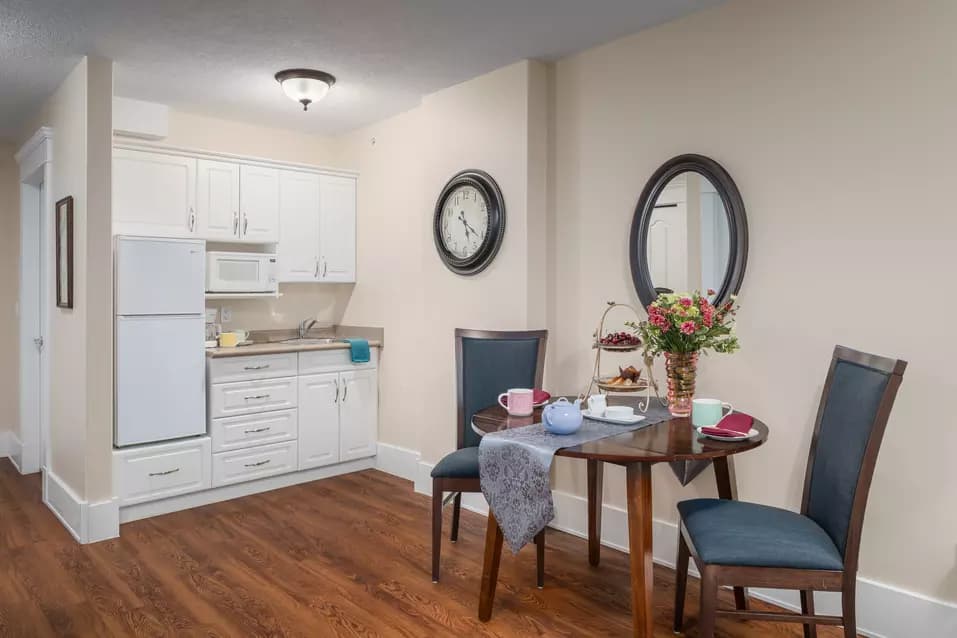 kitchen and small dining room table at chartwell kamloops retirement residence