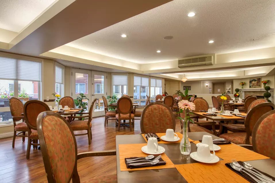 spacious dining room at chartwell royal park retirement residence