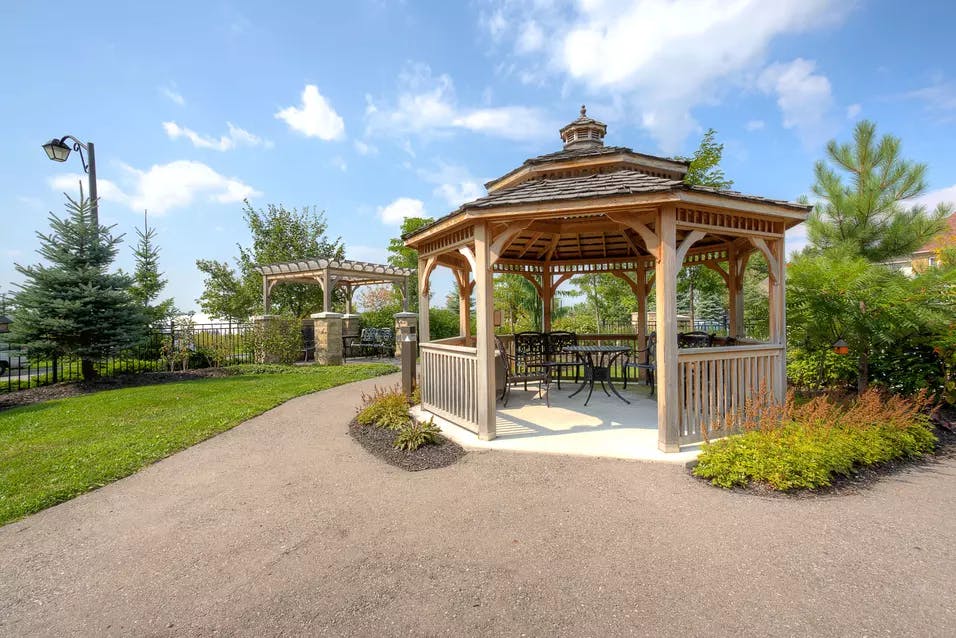 Gazebo and walking paths at Chartwell Hollandview Trail Retirement Residence.