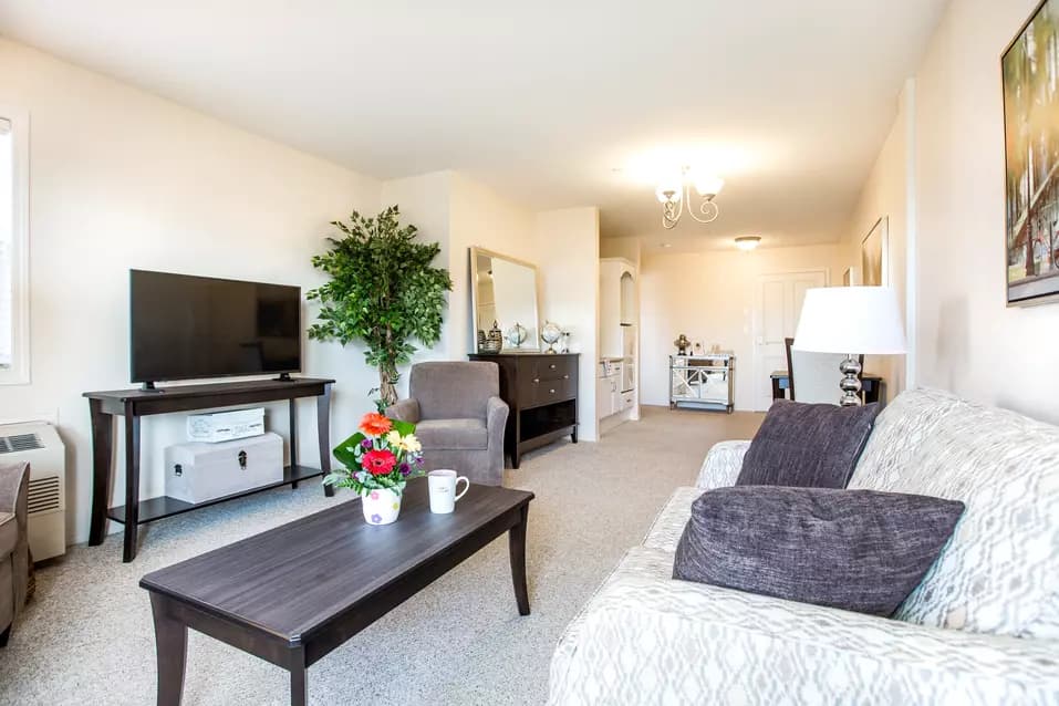 spacious living room at chartwell hawthorn retirement residence